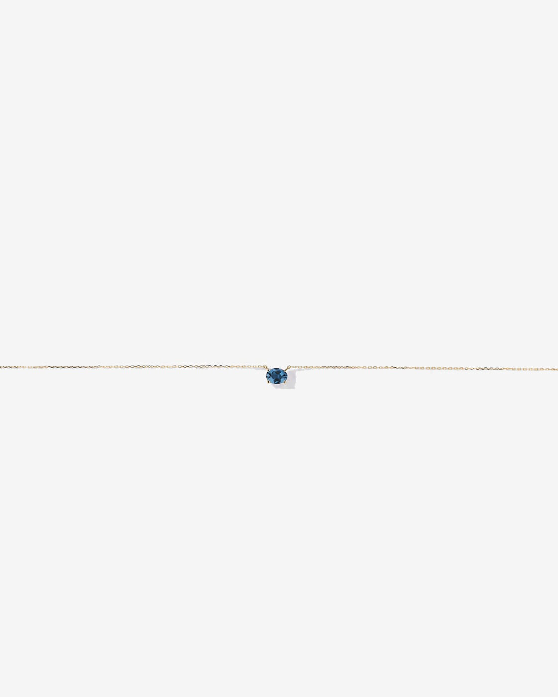 Collier ovale est-ouest Topaze bleu London en or jaune 10 ct