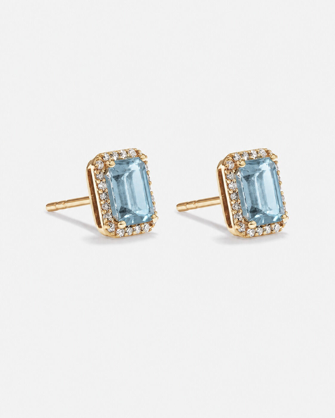 Boucles d'oreilles halo Topaze bleue taille &eacute;meraude avec diamants en or jaune 10 ct